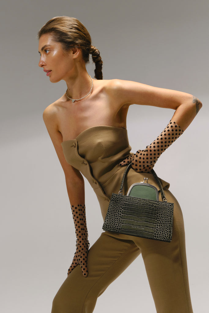 woman-carrying-olive-crocembossed-bag